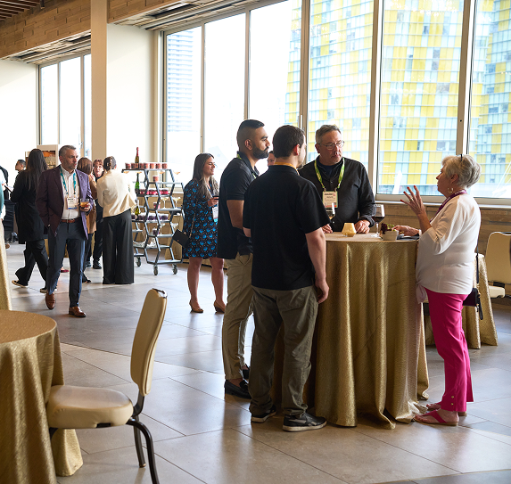 group of people conversing around table