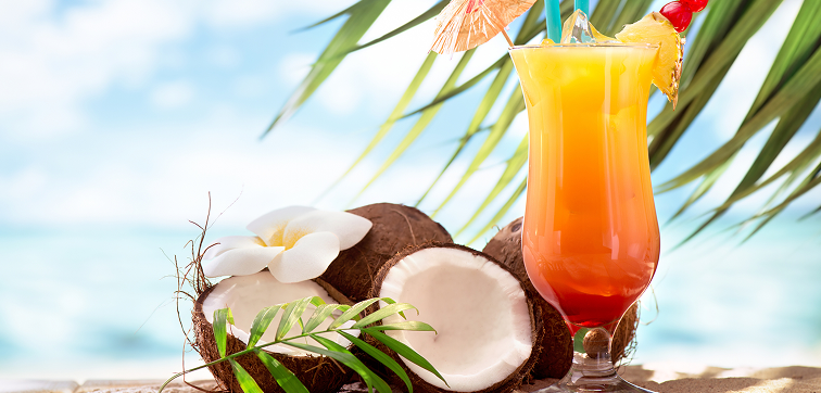 open coconut halves and a tropical cocktail